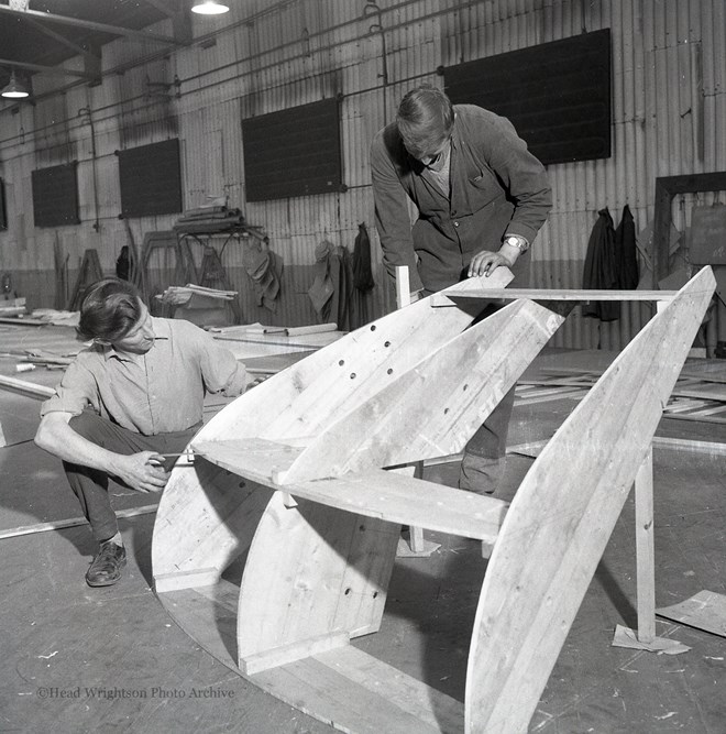 Photographs of apprentices being shown a job