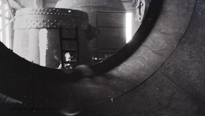 Photographs of apprentices being shown a job