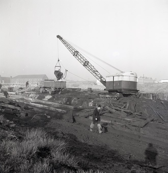 Excavating mud for new slipway