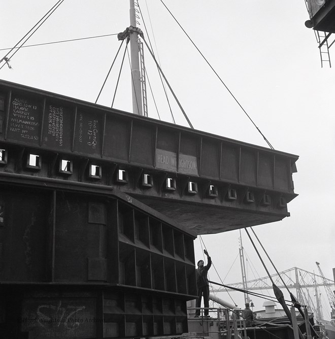 Loading Norweign Charge Pans On Boat