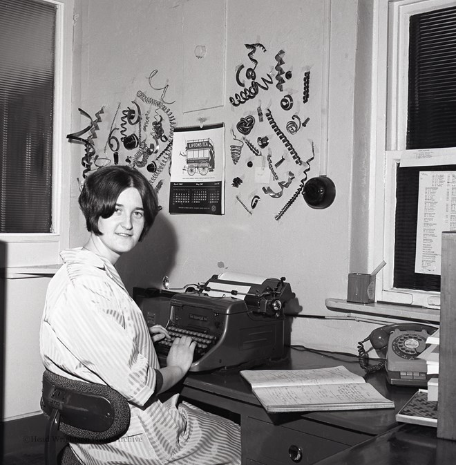 Secretary With Metal Turnings At Machine Co.