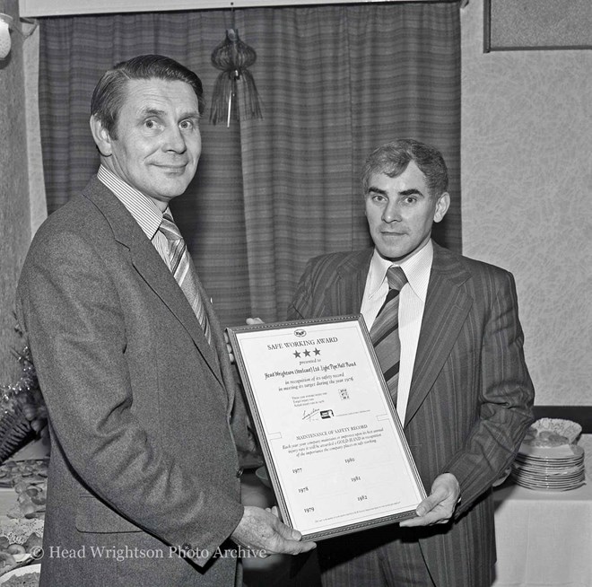 Douglas Harrison (left) presents the Safe Working Award to Peter Crawford.
