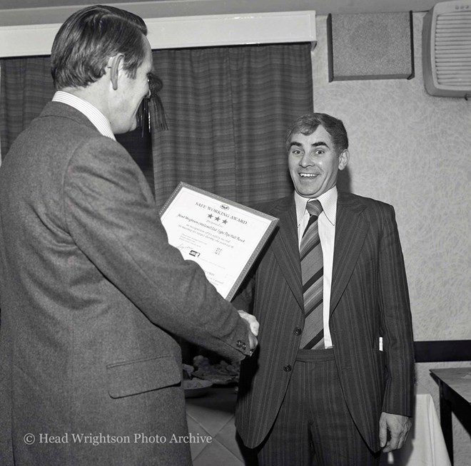 Douglas Harrison (left) presents the Safe Working Award to Peter Crawford.