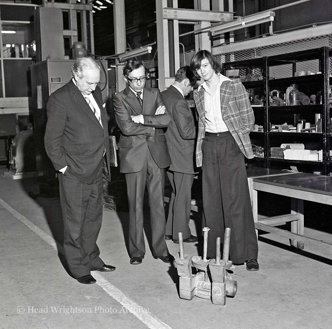 Moulding apprentices and staff reviewing their work