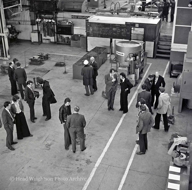 Moulding apprentices and staff reviewing their work