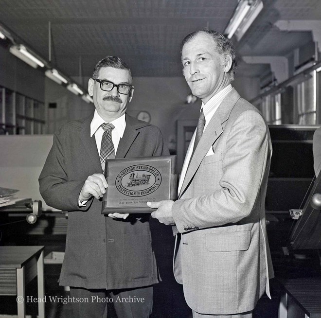 Representing Hartford Steam Boiler Ltd, Mr Harry Honeyfield (left) presents to Mr John Edwards, of HWT an inspection and insurance plaque