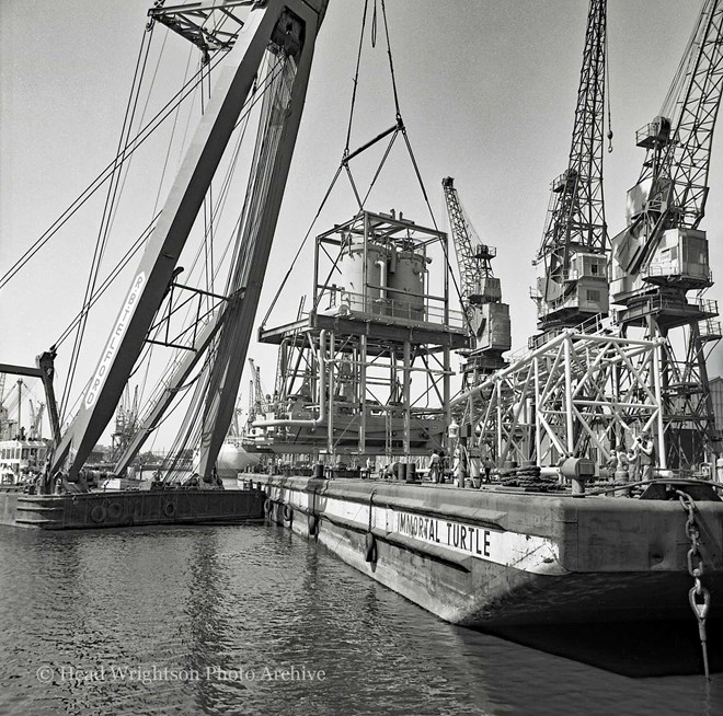 Floating crane loading equipment onto barge, Middlesbrough Docks