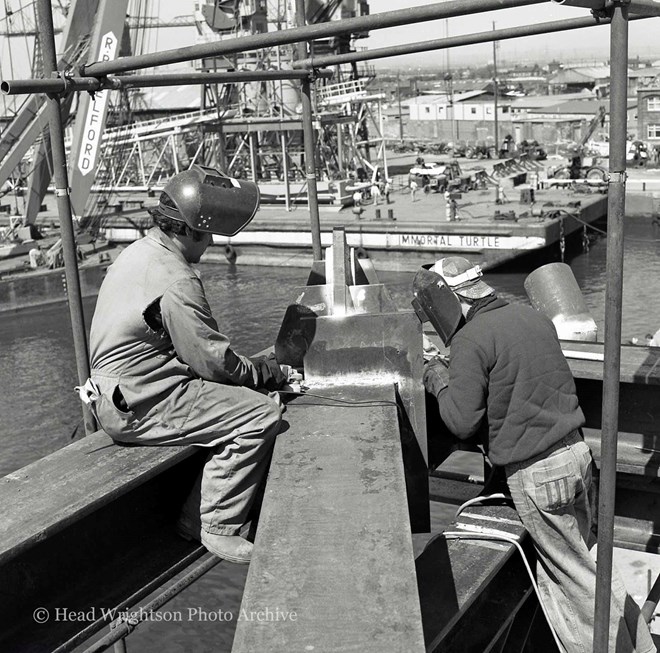 A pair of welders working high above Middlesbrough Docks