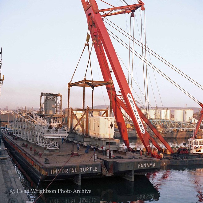 Floating crane loading equipment onto barge, Middlesbrough Docks