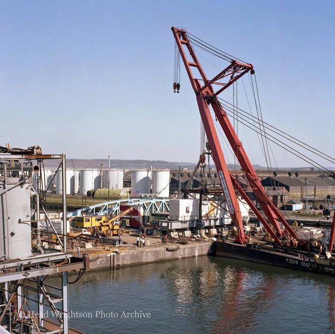 Floating crane loading equipment onto barge, Middlesbrough Docks