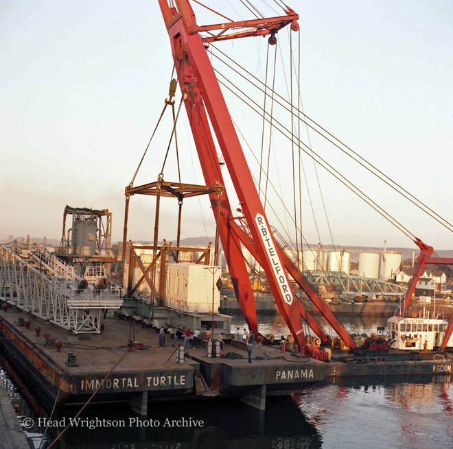 Floating crane loading equipment onto barge, Middlesbrough Docks