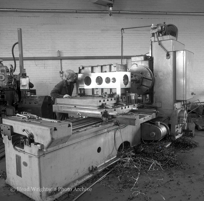 Male working on a Kearns Horizontal Mill