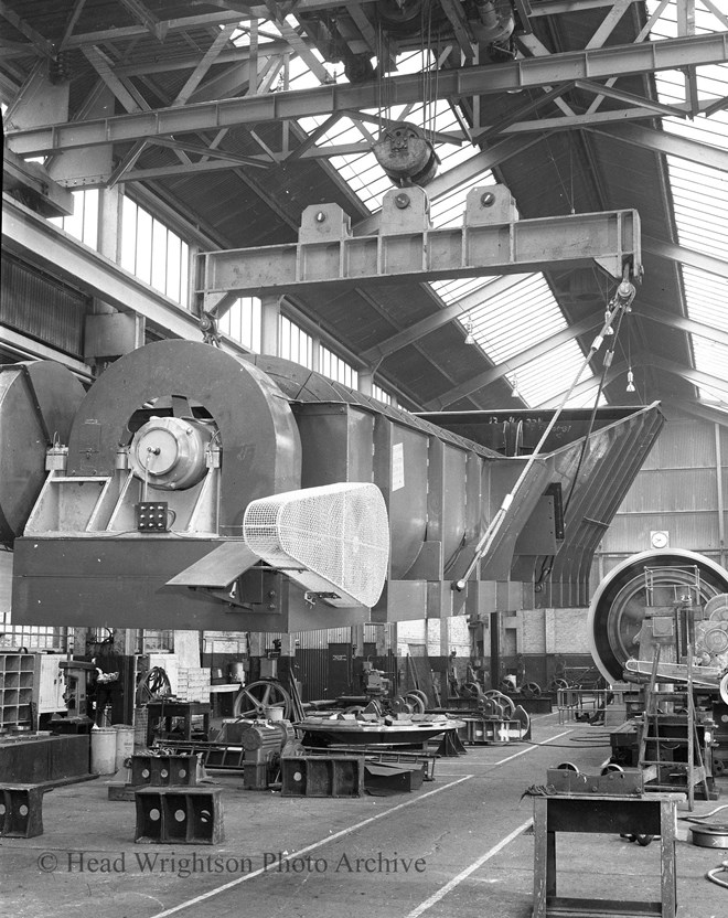 A lifting beam is being used by an overhead crane to lift a classifier in Stockton forge fitting shop.