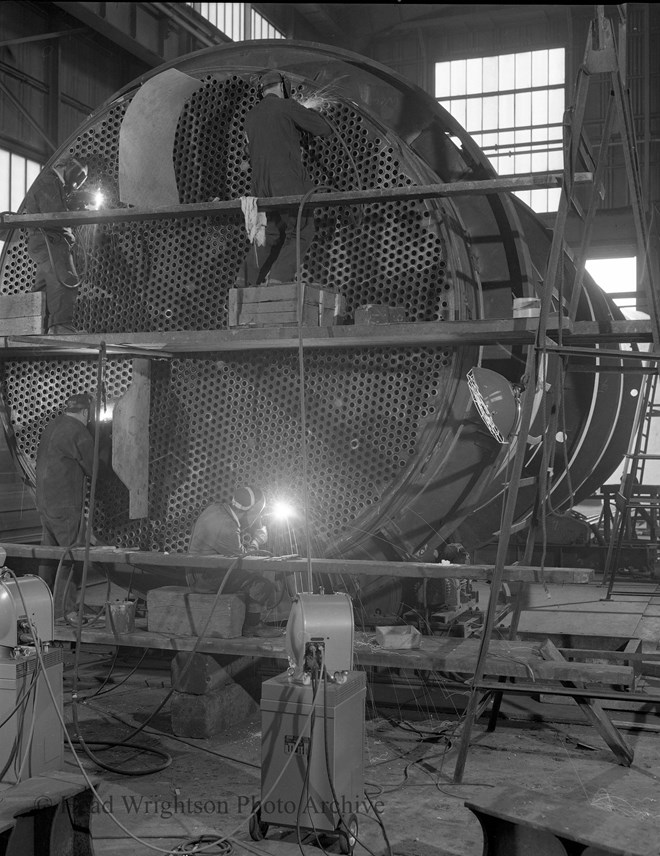 A Welder Working on I.C.I Reactor 