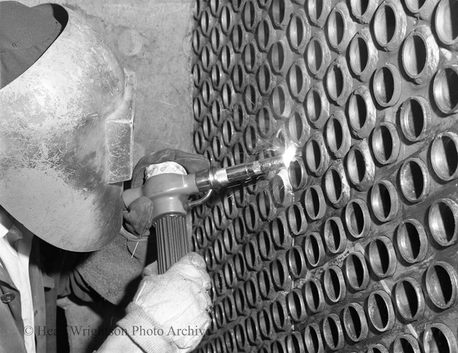 A Welder Working on I.C.I Reactor 