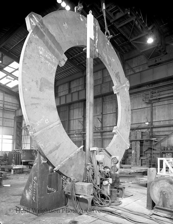 Large circular ring being welded in site shop