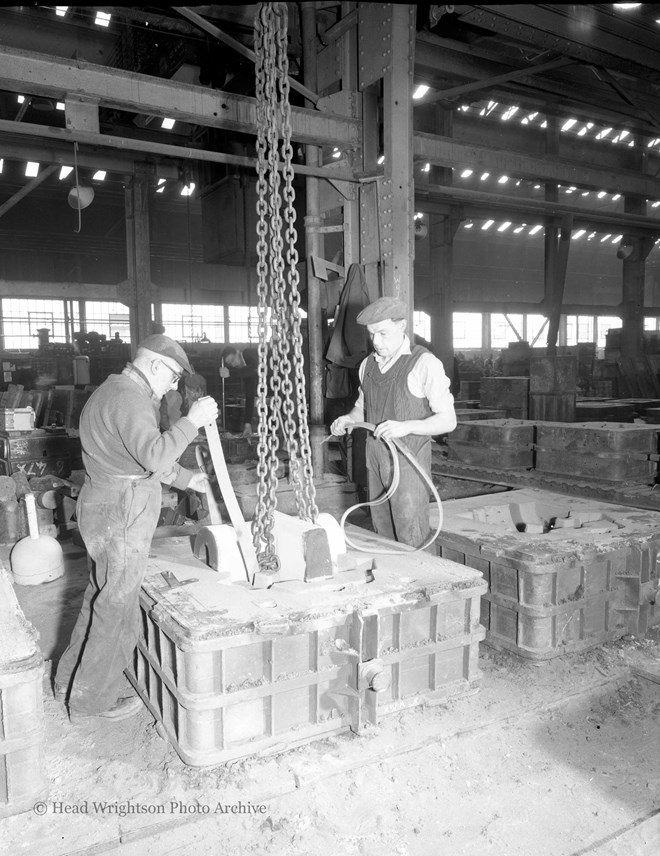 Placing core on mold in foundry (Dulal)