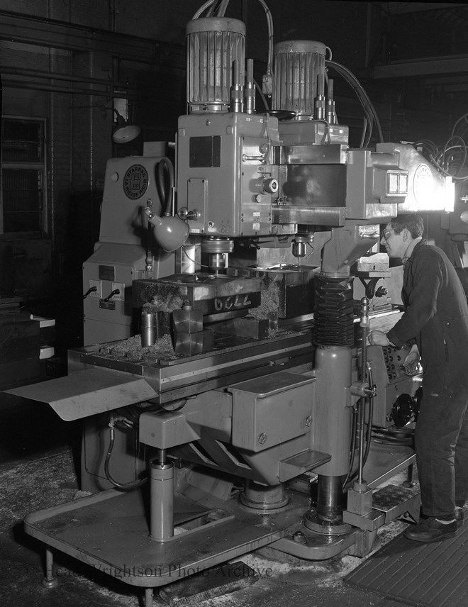 Man Finishing Die With Grinder