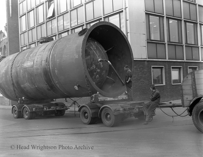 large vessel for ICI being lifted & on lorry