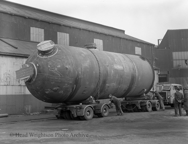 large vessel for ICI being lifted & on lorry