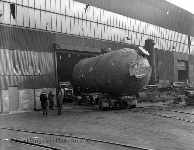 large vessel for ICI being lifted & on lorry