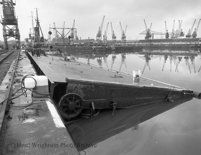 tema dock gate @ no 3 berth (M'bro) with sea going tug