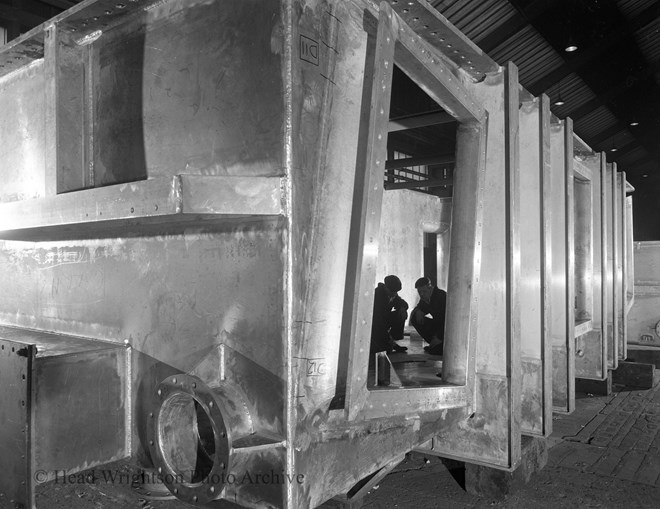 Aluminium transfer tank (plus two workers)