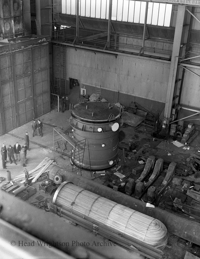 Reactor vessel under construction and being transported. Heat exchanger bundle in foreground.