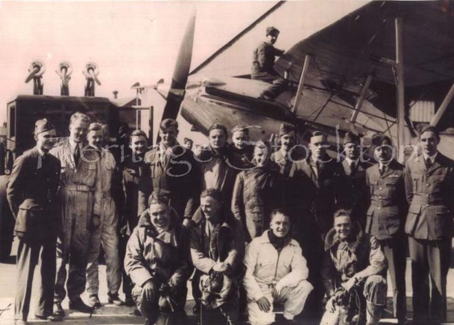 Members of 608 Squadron posing in front of a Hawker Demon.
Far left William Appleby-Brown, 4th from left Keith Pyman, 6th from left Geoffrey Shaw, 10th from left Geoffrey Whitley-Garnett, and 12th from left Neil McCourt.