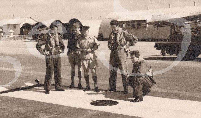 Former 608 Squadron Commanding Officer George Martin, Flying Officer Harry Bates, Flying Officer Cook, Pilot Officer Ken Temple and Flying Officer Mackenzie inspecting a target drogue at RAF North Front in Gibraltar 1955