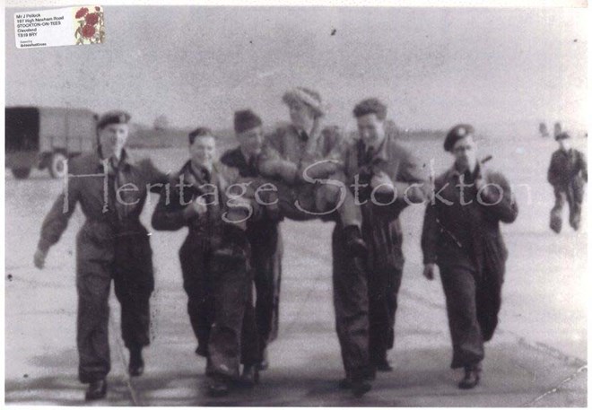 Members of 608 Squadron carrying Neil Hancock after he collided his Vampire VZ 155 aircraft with VZ838 at RAF Ouston 27 March 1954. 
Both pilots survived but Neil Hancock's aircraft was damaged beyond repair.