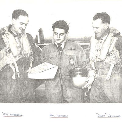 608 Air crew examining a map