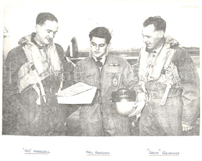 608 Air crew examining a map